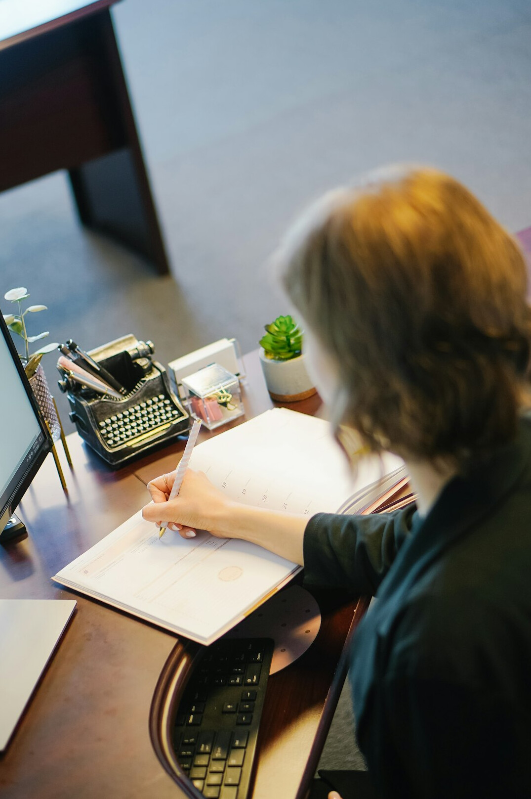 writer at desk with notes