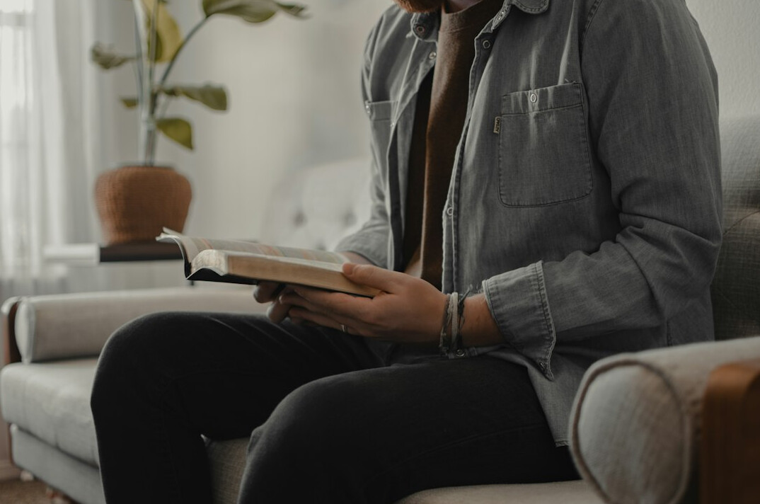 person reading thriller book